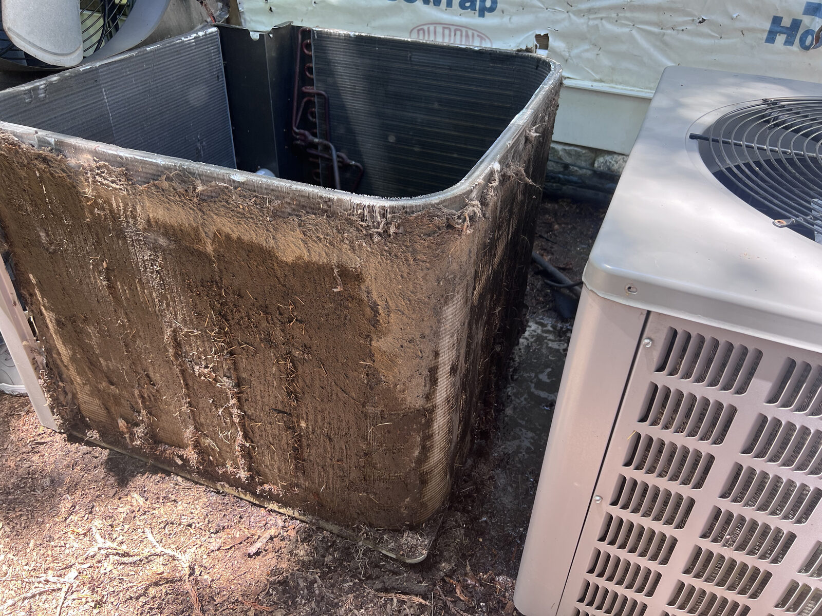 Clogged air vent full of dirt before professional cleaning